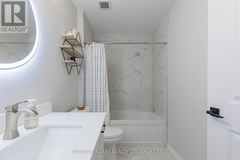 208 - 120 Springvalley Crescent — photo 34 of 40