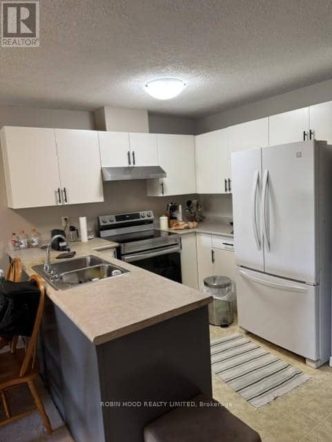 203 - 3160 Wildwood Drive — photo 2 of 12
