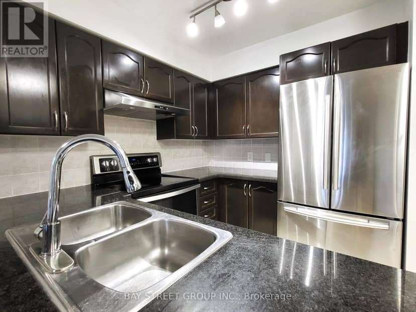 209 - 7363 Kennedy Road — photo 7 of 40