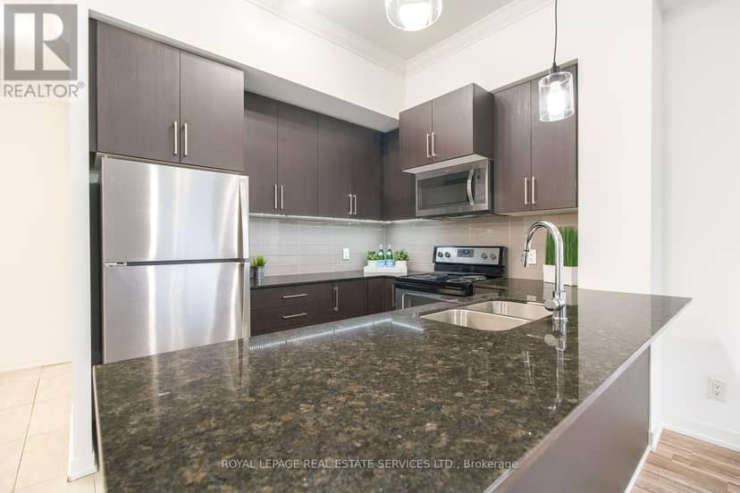1605 - 840 Queens Plate Drive — photo 8 of 25