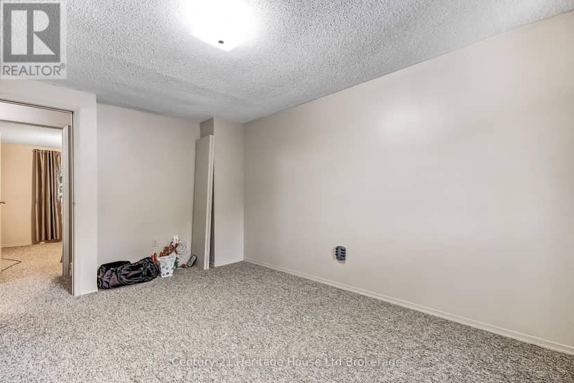 37 - 455 Springbank Avenue N — photo 5 of 14