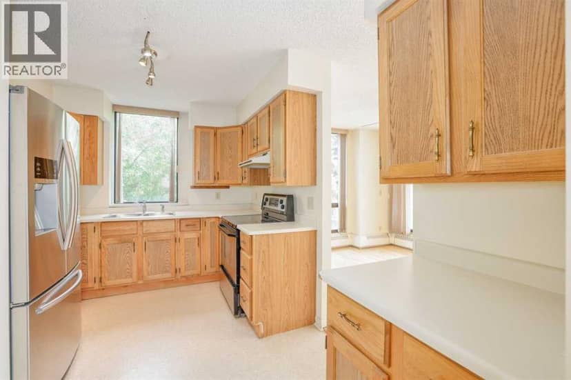 208, 80 Point Mckay Crescent NW — photo 11 of 18