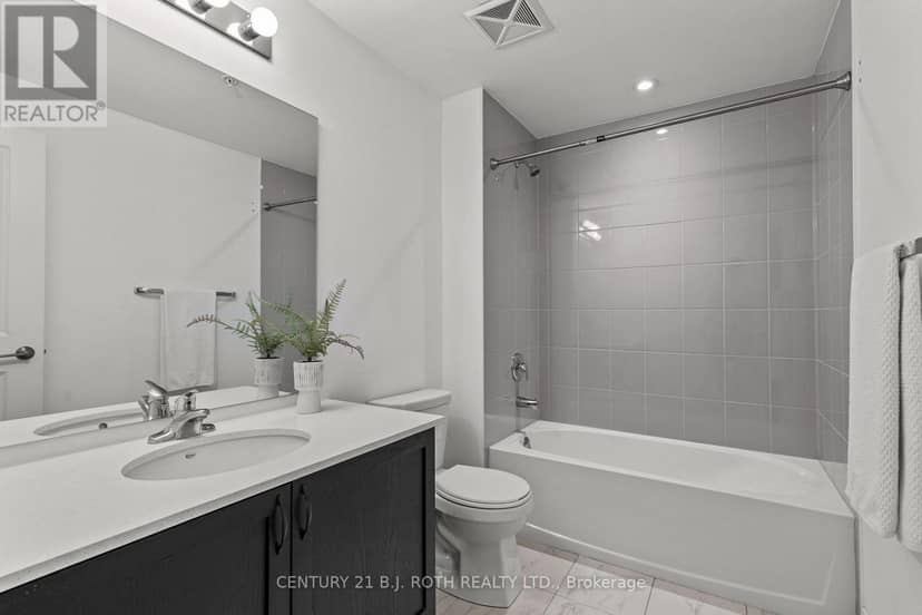 510 - 304 Essa Road — photo 16 of 27