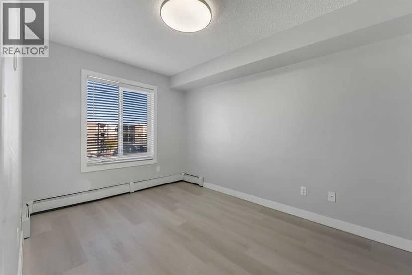 2402, 403 Mackenzie Way SW — photo 24 of 36
