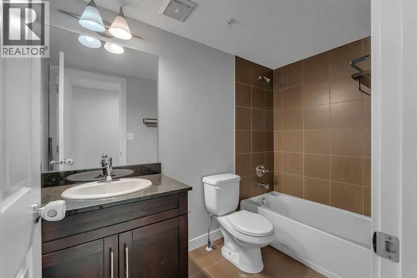 2402, 403 Mackenzie Way SW — photo 30 of 36