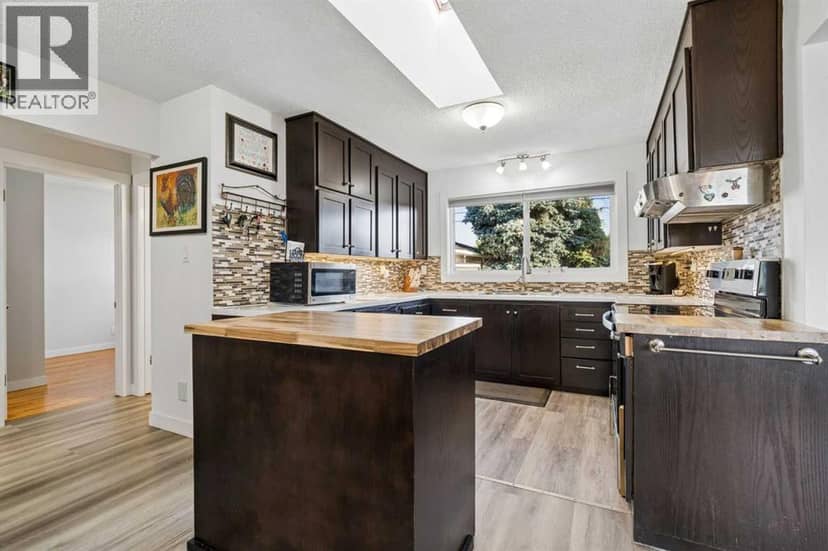 5635 Travis Crescent NE — photo 11 of 40