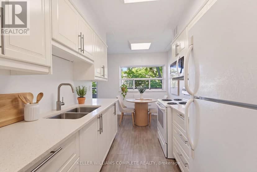 210 - 11 Woodman Drive S — photo 10 of 30